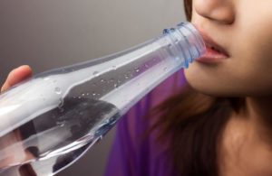 dry mouth - women drinks water